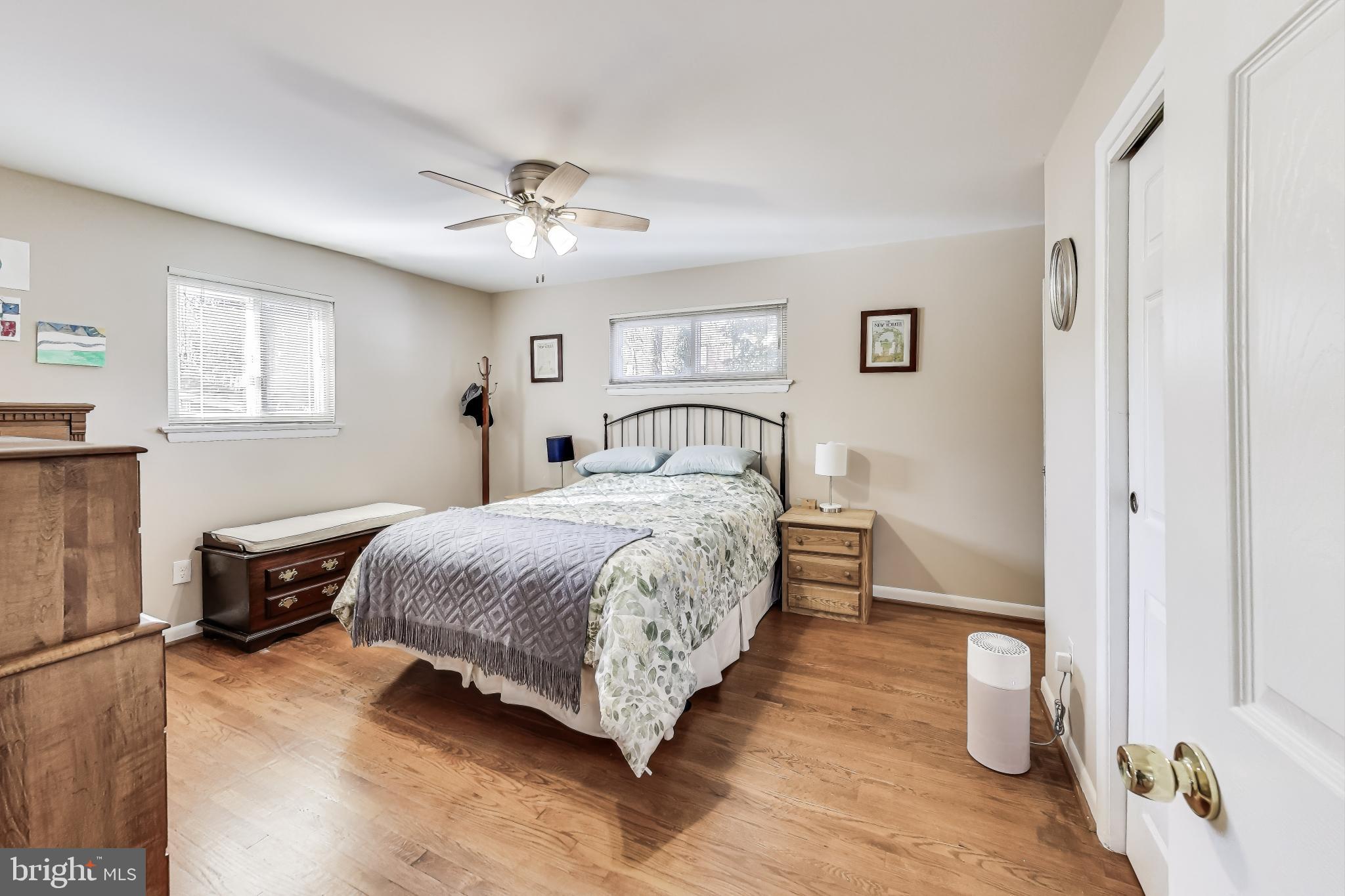 9512 Flower Avenue Silver Spring, MD 20901 - Photo 17 of 41 a bedroom with a bed and a couch