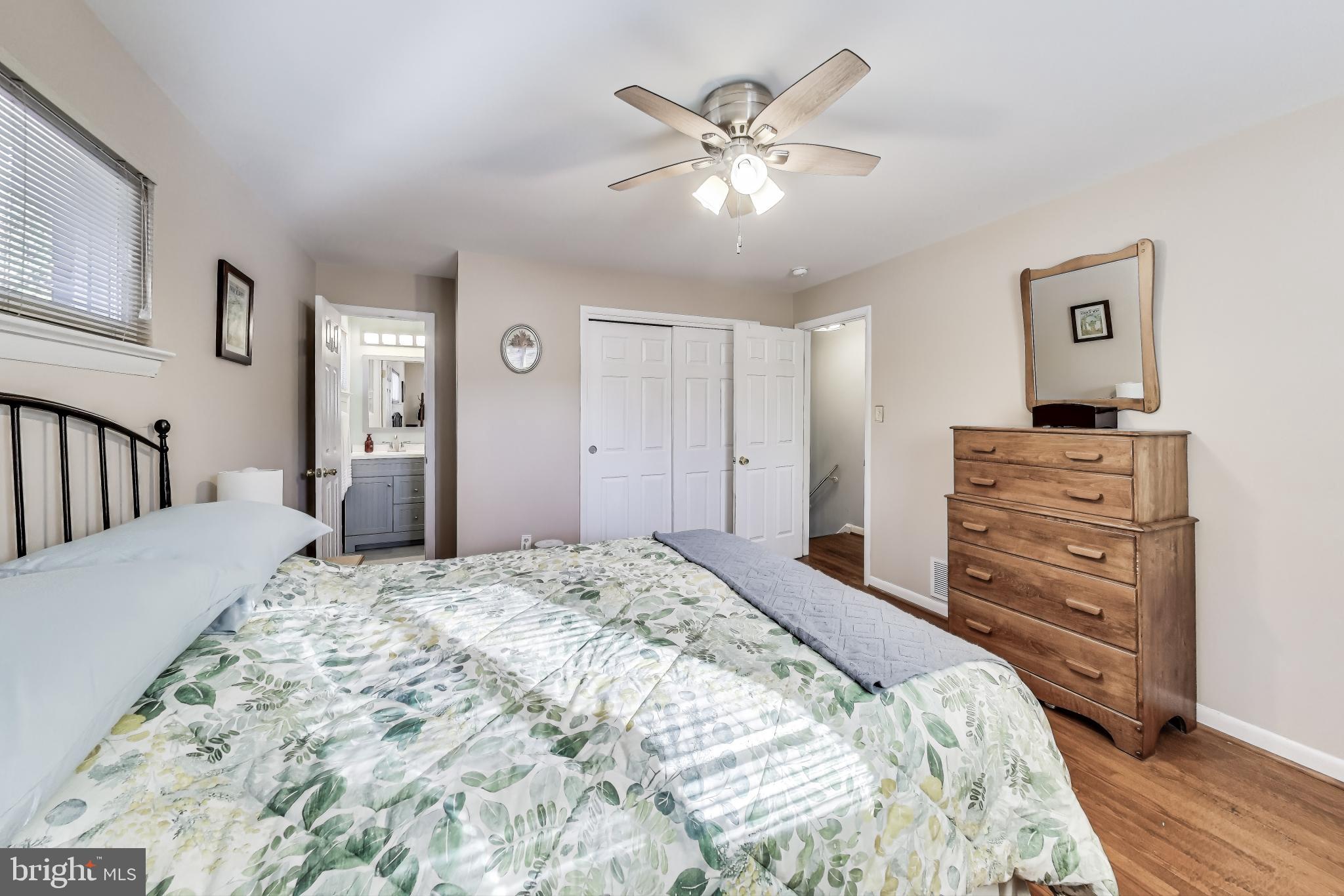 9512 Flower Avenue Silver Spring, MD 20901 - Photo 19 of 41 a spacious bedroom with a bed and a dresser