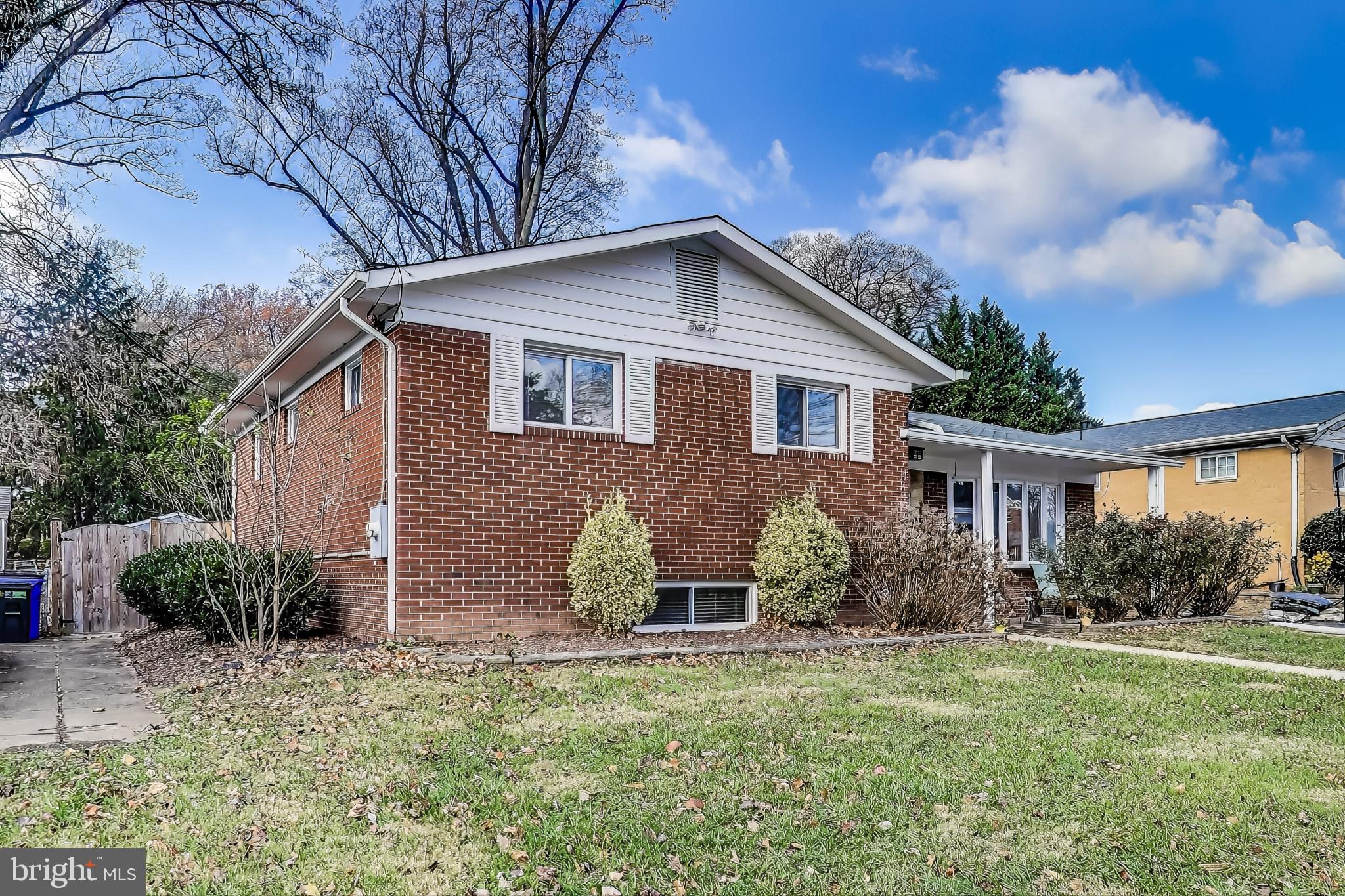 9512 Flower Avenue Silver Spring, MD 20901 - Photo 2 of 41 a house view with a garden space