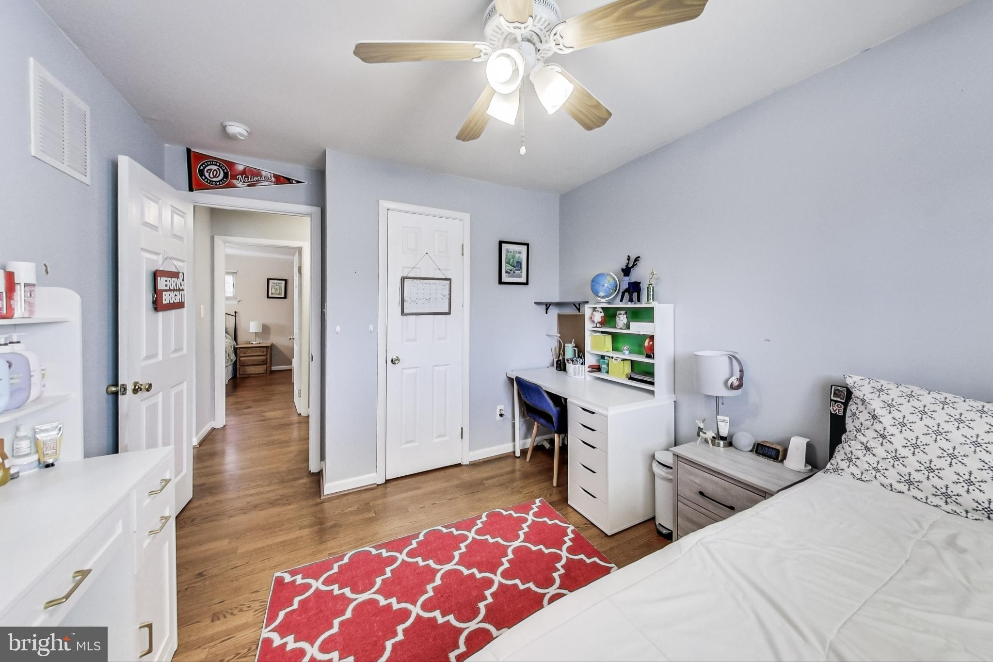 9512 Flower Avenue Silver Spring, MD 20901 - Photo 23 of 41 a bedroom with two beds and a lamp