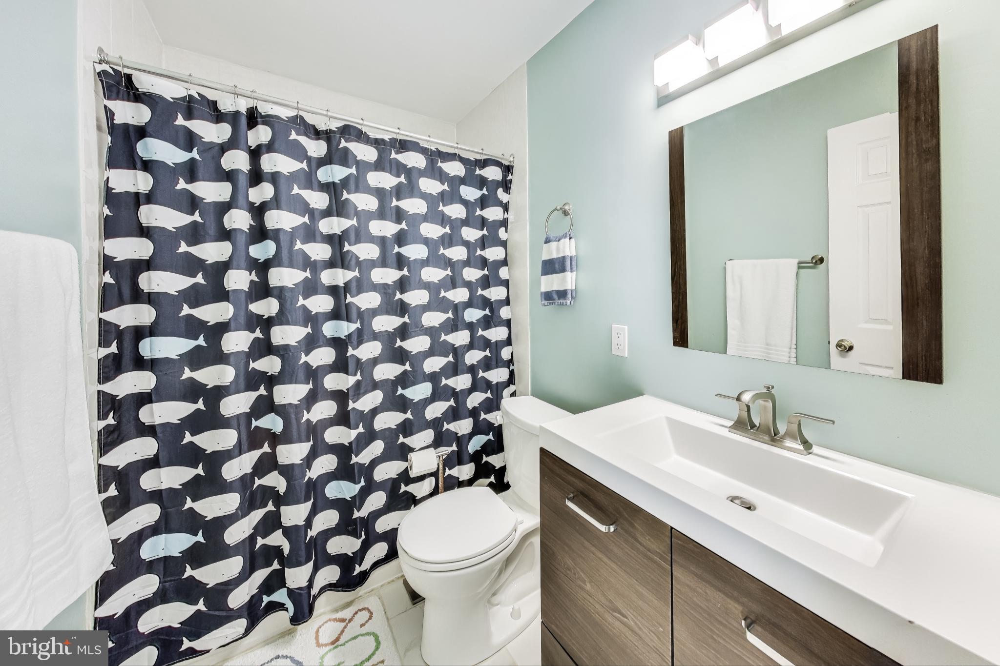 9512 Flower Avenue Silver Spring, MD 20901 - Photo 26 of 41 a bathroom with a sink and a toilet