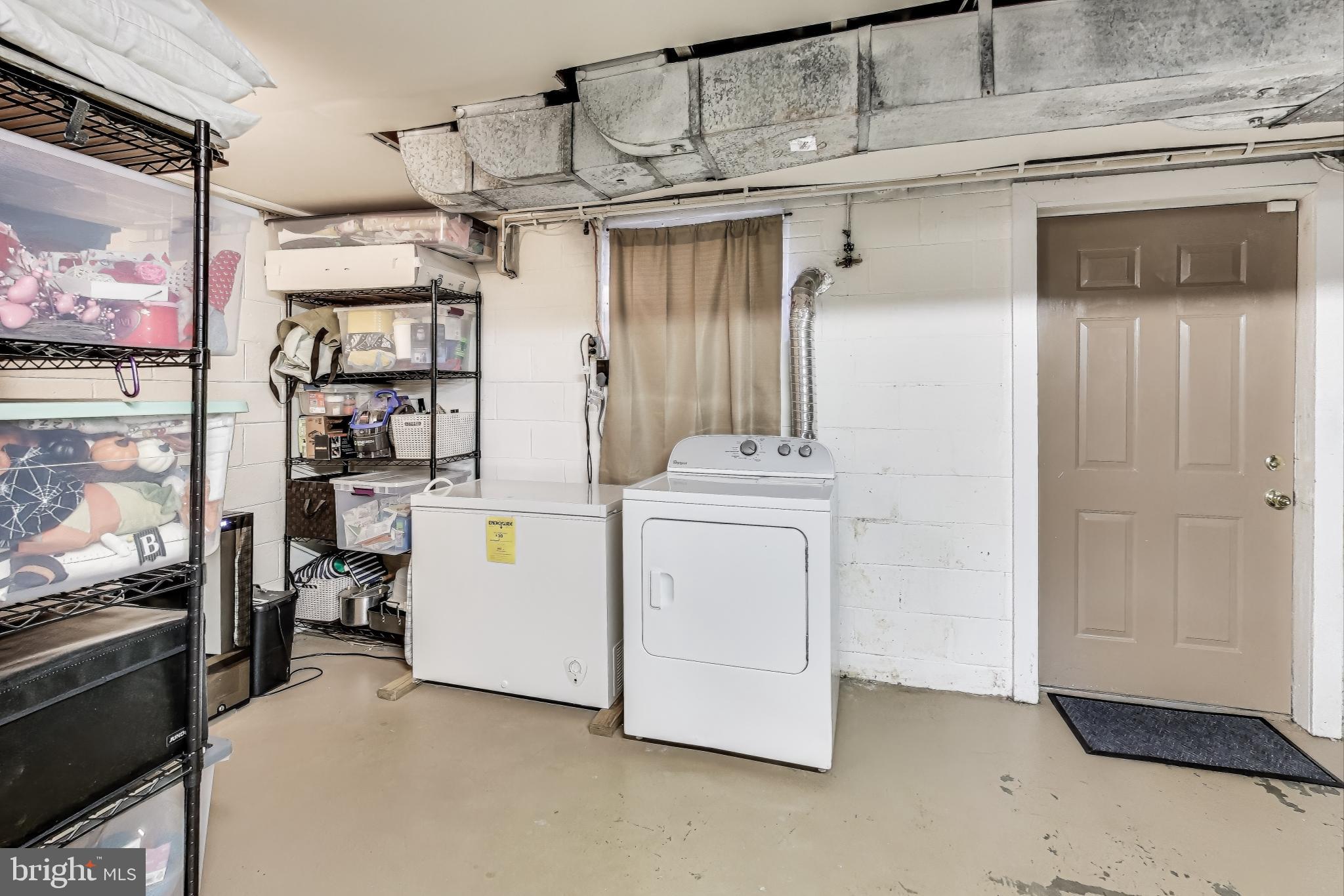 9512 Flower Avenue Silver Spring, MD 20901 - Photo 32 of 41 a utility room with dryer and washer