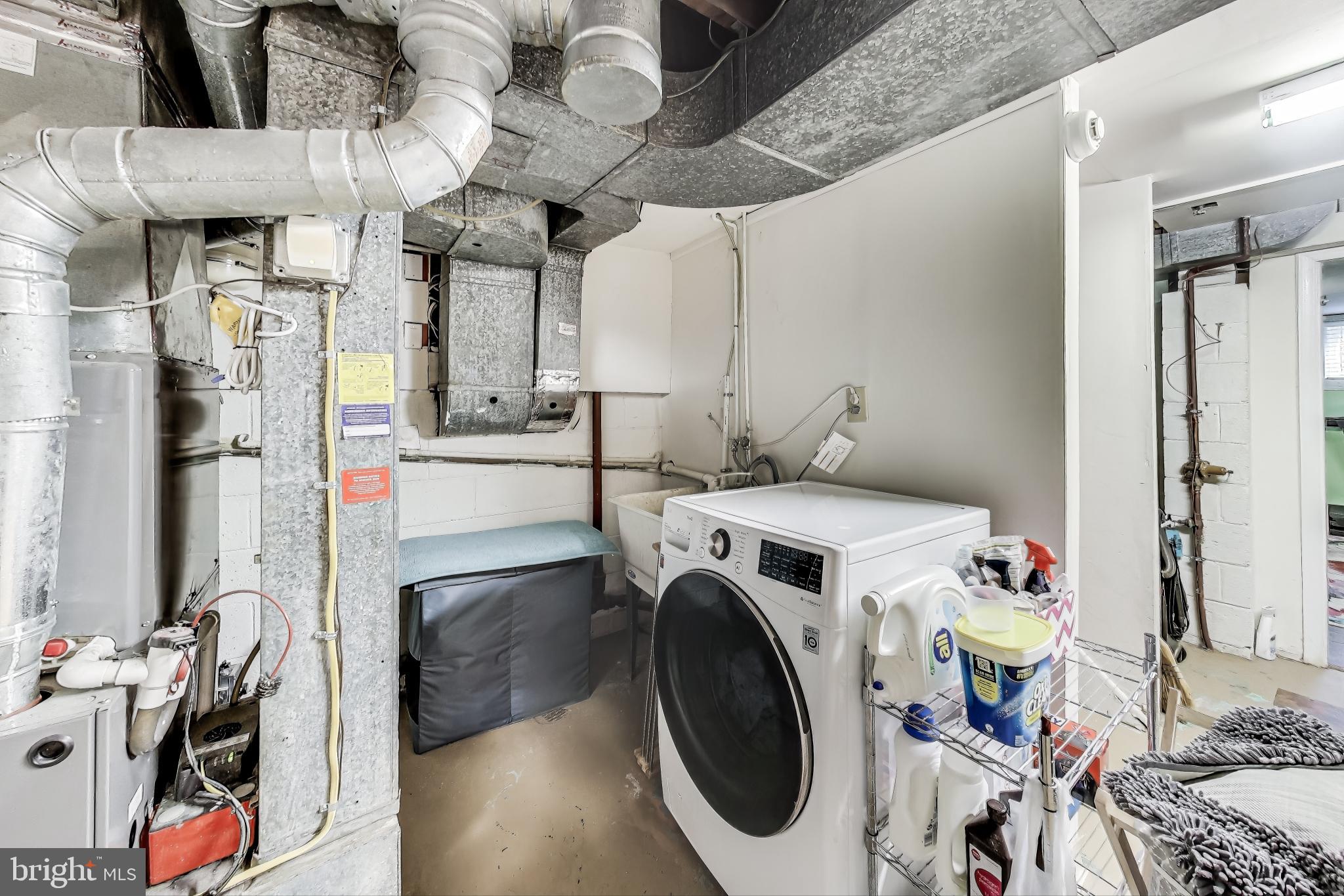 9512 Flower Avenue Silver Spring, MD 20901 - Photo 33 of 41 a utility room with dryer and washer