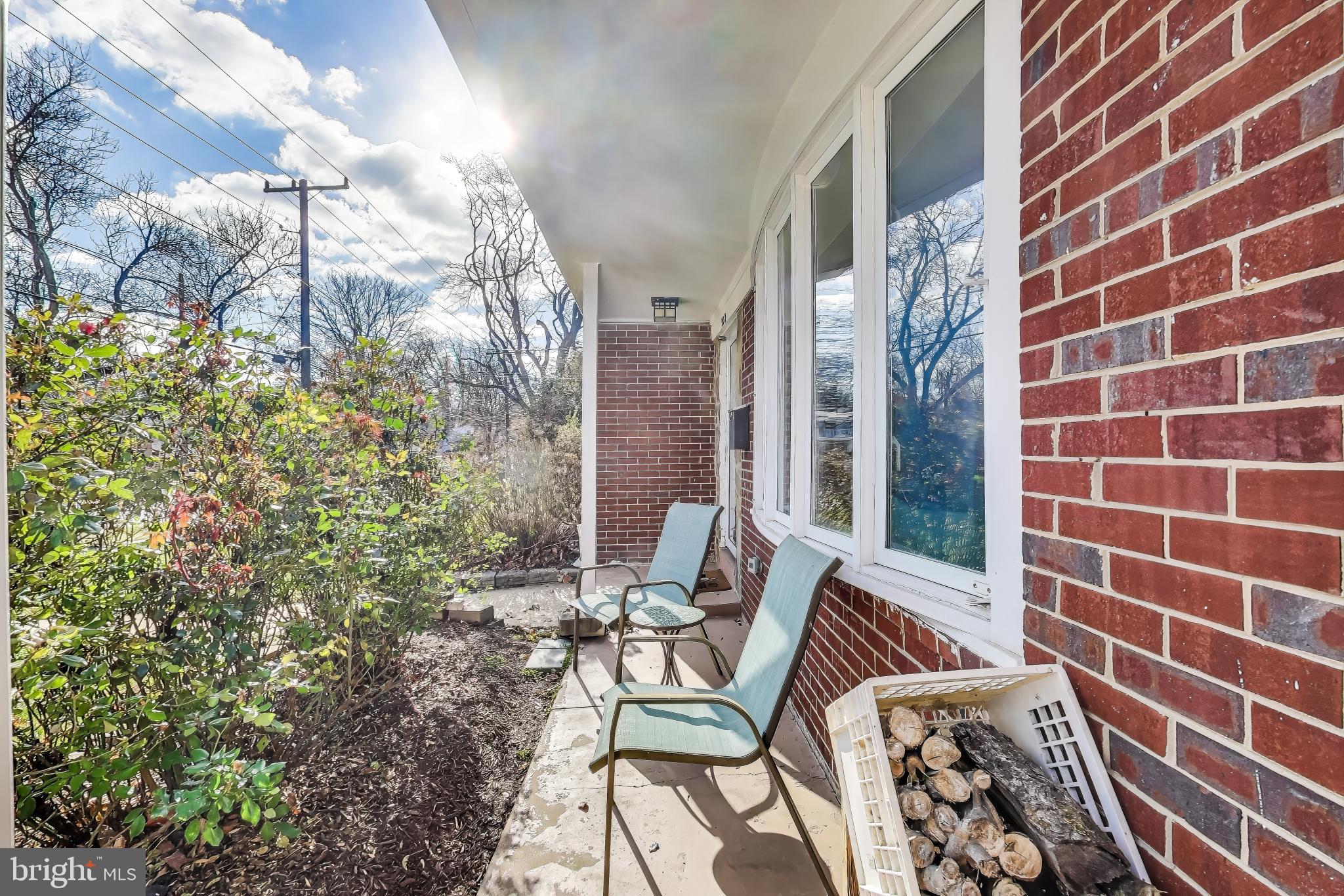 9512 Flower Avenue Silver Spring, MD 20901 - Photo 4 of 41 a view of a balcony with chairs and a potted plant