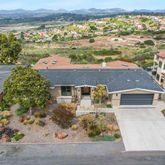 an aerial view of a house with a lake view