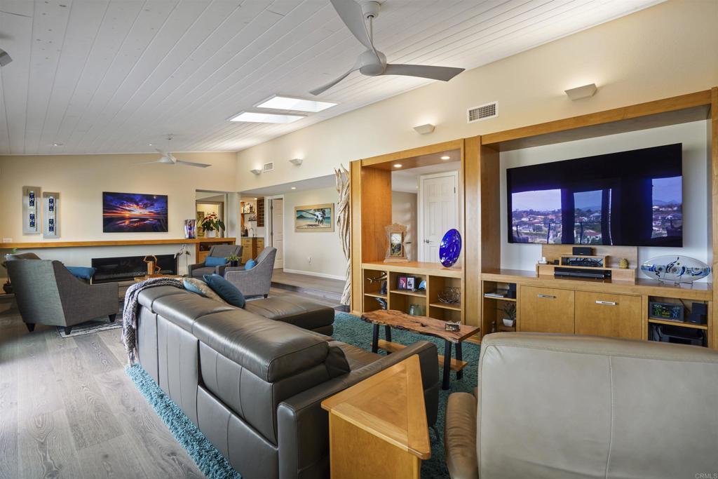 656 Canyon Drive Solana Beach, CA 92075 - Photo 11 of 29 a living room with furniture and a flat screen tv