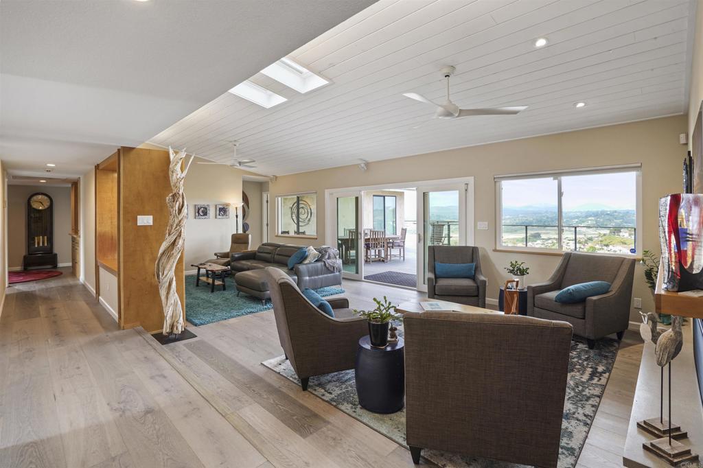 656 Canyon Drive Solana Beach, CA 92075 - Photo 7 of 29 a living room with furniture large window and glass door