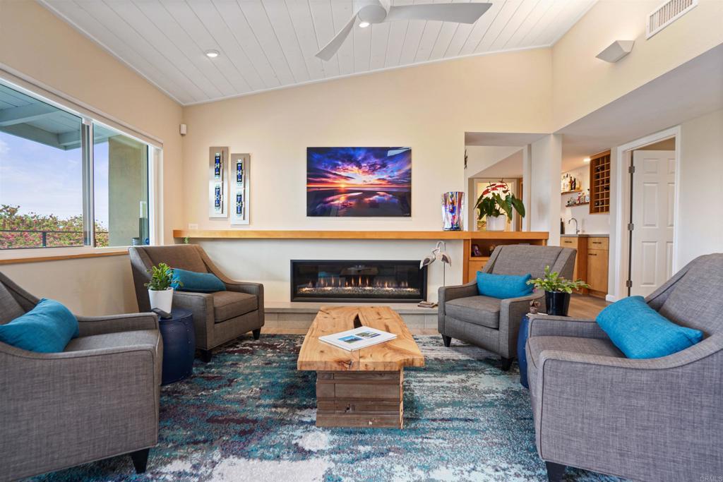 656 Canyon Drive Solana Beach, CA 92075 - Photo 8 of 29 a living room with furniture and a fireplace