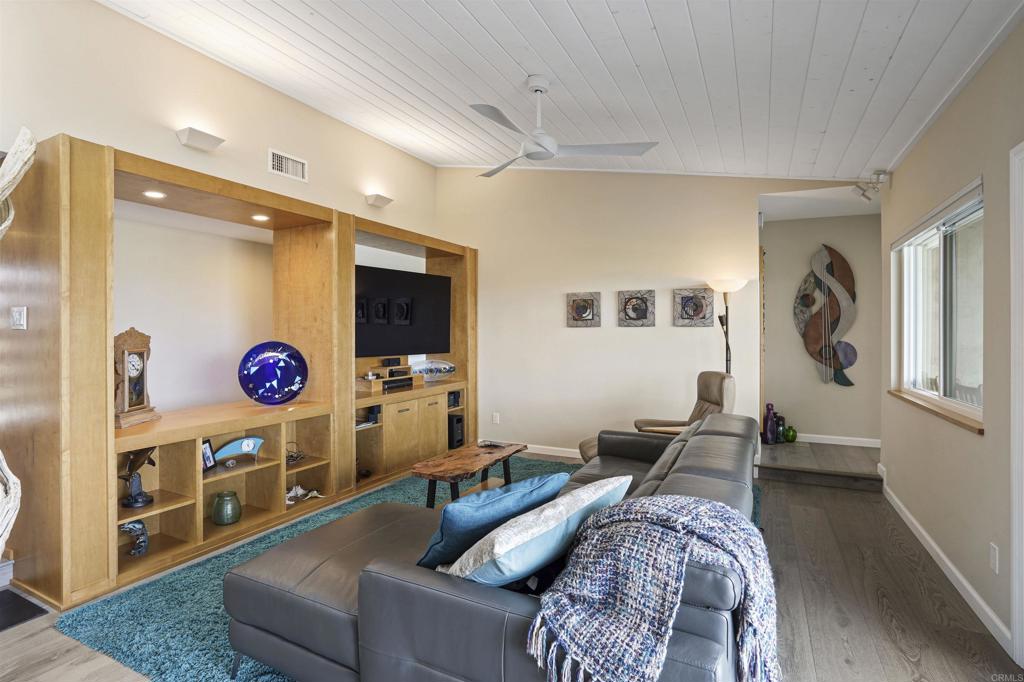 656 Canyon Drive Solana Beach, CA 92075 - Photo 10 of 29 a living room with furniture and a flat screen tv
