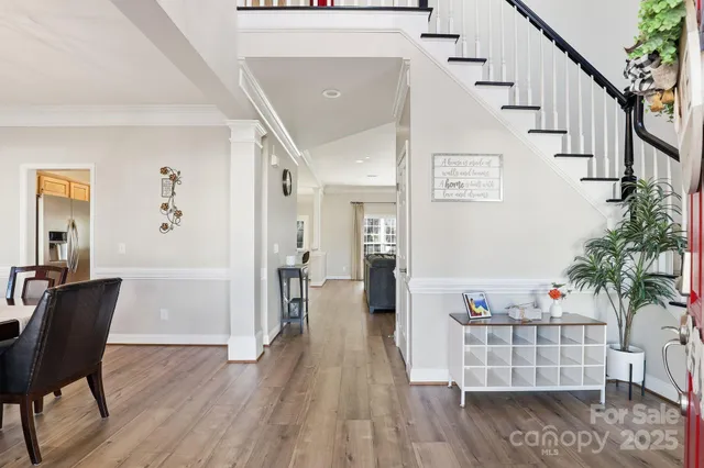 a view of entryway with wooden floor and stairs