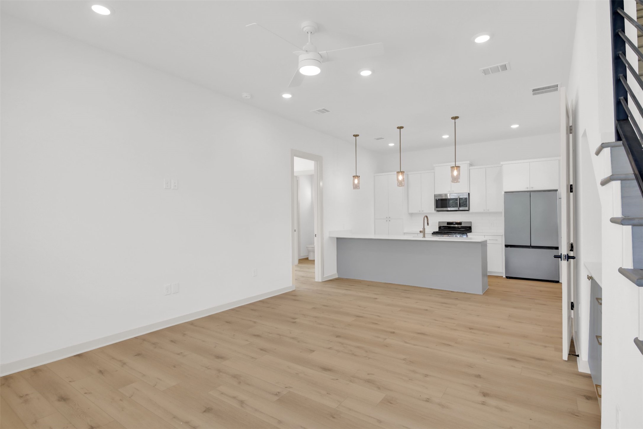 7208 Providence Avenue, Unit 1 Austin, TX 78752 - Photo 3 of 26 Open concept living space featuring light wood-style flooring and recessed lighting