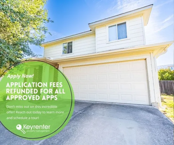 a view of a swimming pool with a fountain in the background