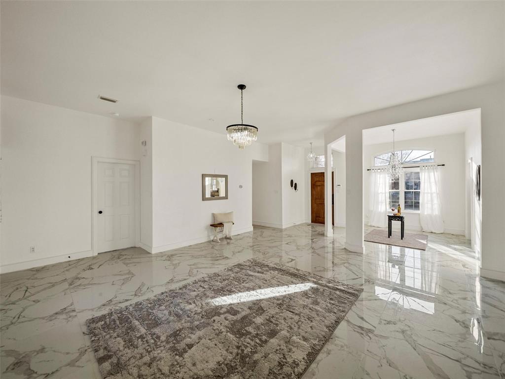 a view of a big room with wooden floor and a bathroom