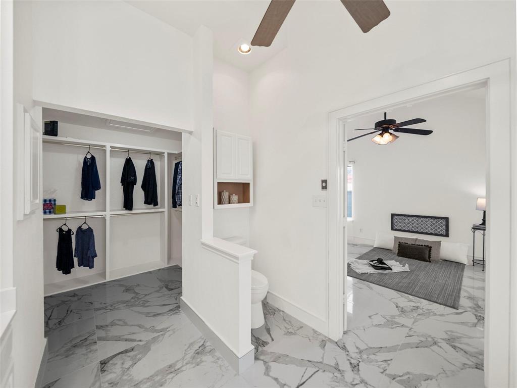 4818 Mize Court Rowlett, TX 75088 - Photo 11 of 21 a view of a hallway with bathroom and mirror