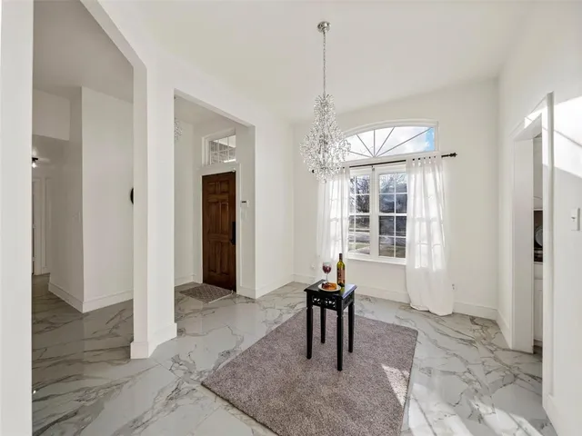 a view of a livingroom with furniture window and wooden floor