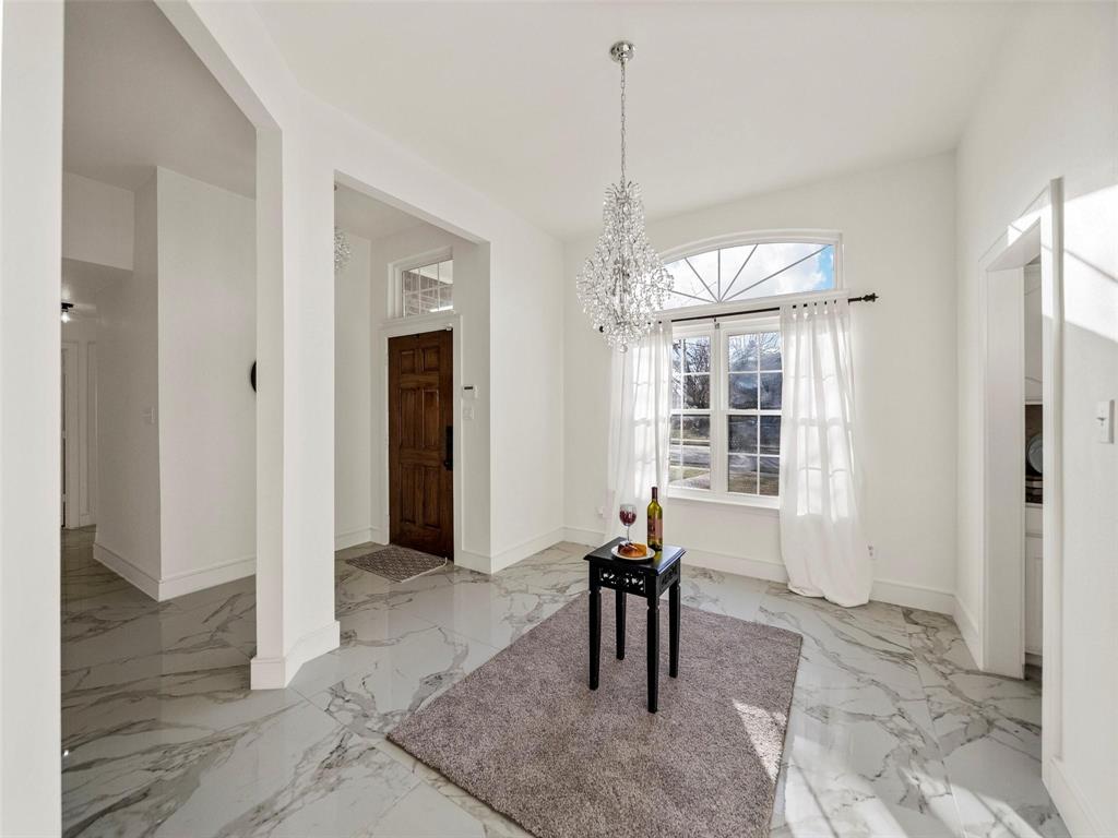 4818 Mize Court Rowlett, TX 75088 - Photo 5 of 21 a view of a livingroom with furniture window and wooden floor