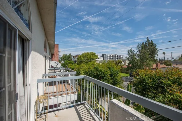 a view of a balcony with an outdoor space