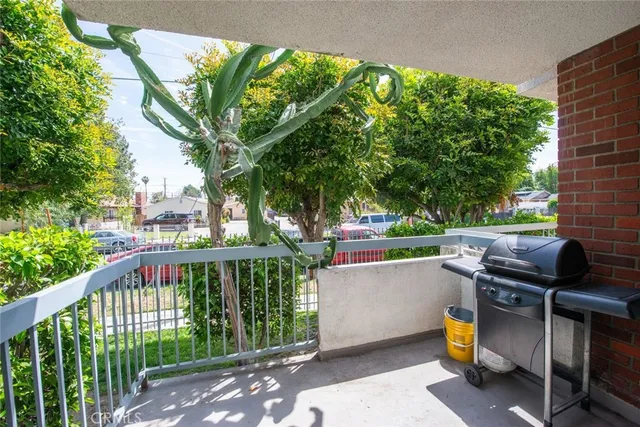a view of a two chairs in the balcony