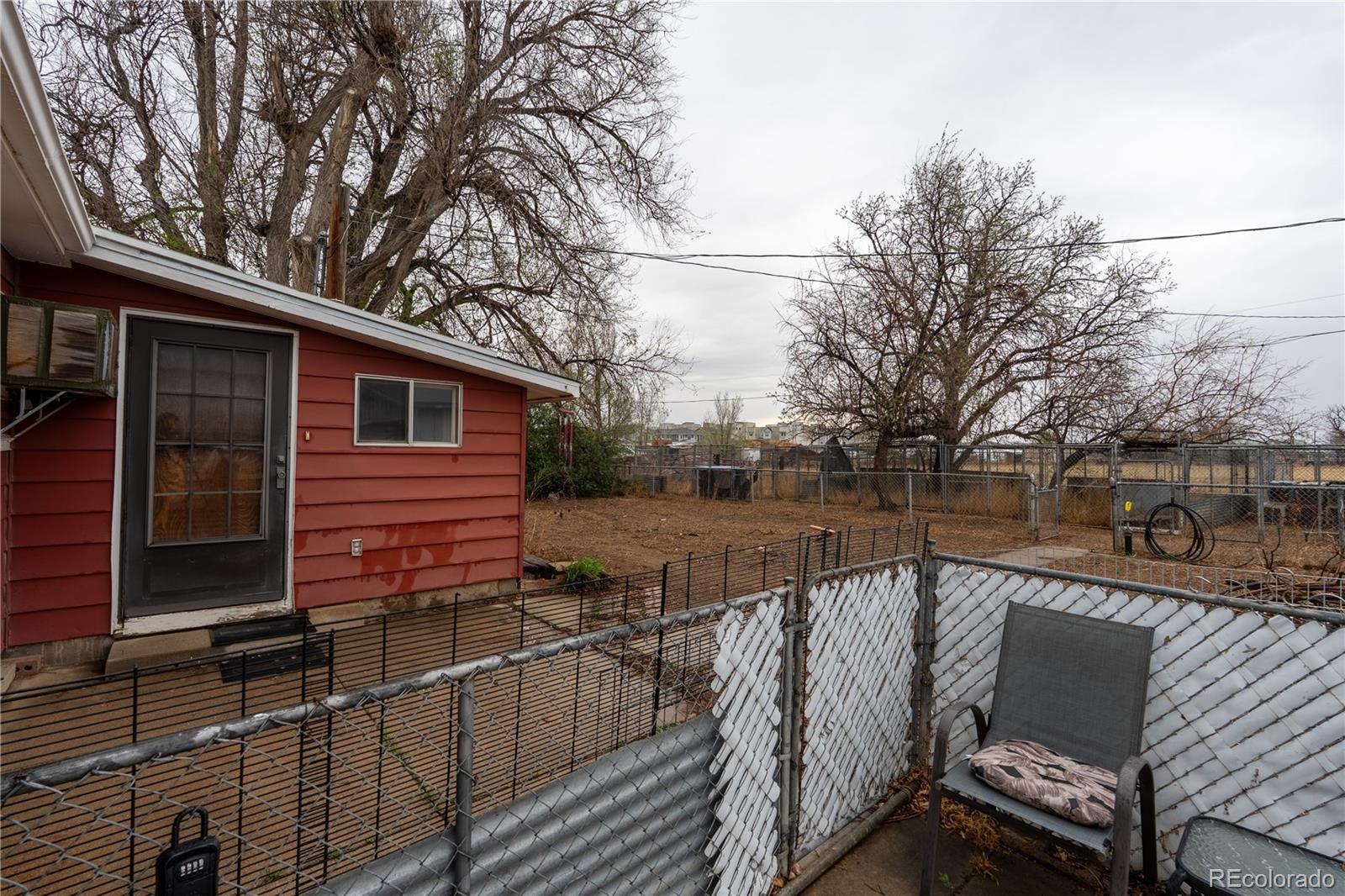 12169 East Baseline Road Lafayette, CO 80026 - Photo 23 of 39 a view of a house with backyard and sitting area