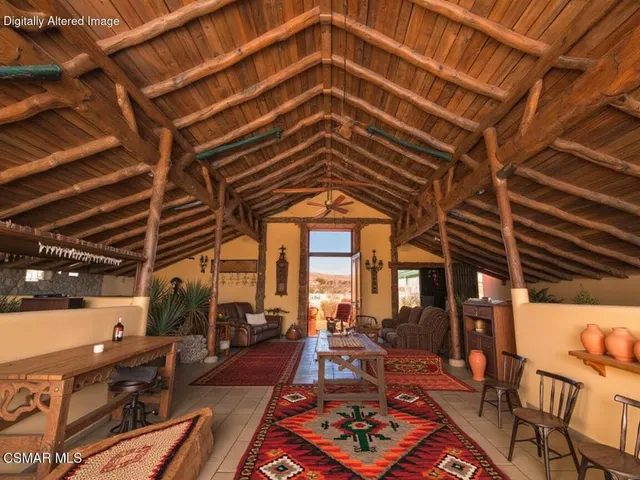 a view of a balcony with furniture and wooden floor