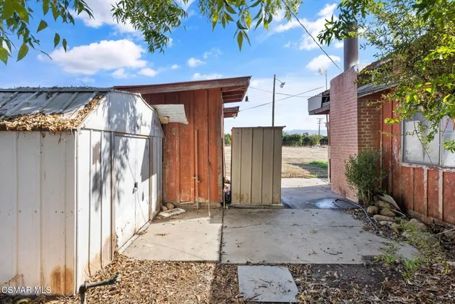 a kitchen with stainless steel appliances granite countertop a sink window and cabinets