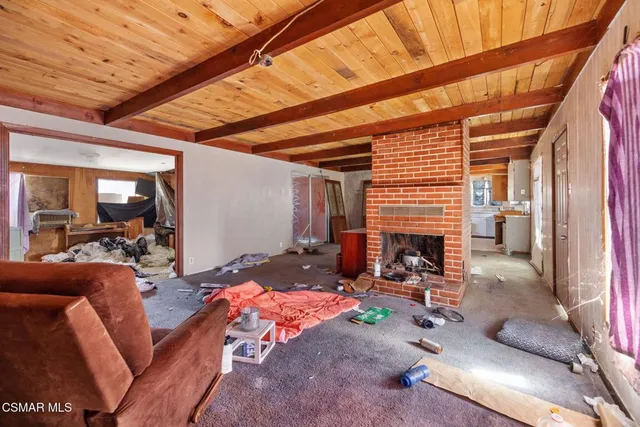 a bedroom with furniture and workout equipment