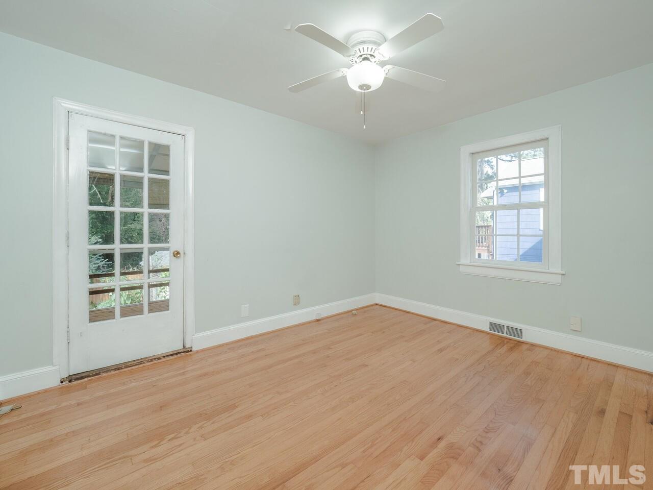 408 Morrison Avenue Raleigh, NC 27608 - Photo 14 of 29 Spacious master with access to the adjoining rear screened-in porch.