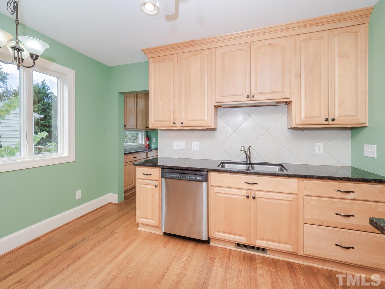 408 Morrison Avenue Raleigh, NC 27608 - Photo 8 of 29 Clean up is a breeze with sink and dishwasher within close proximity of each other.