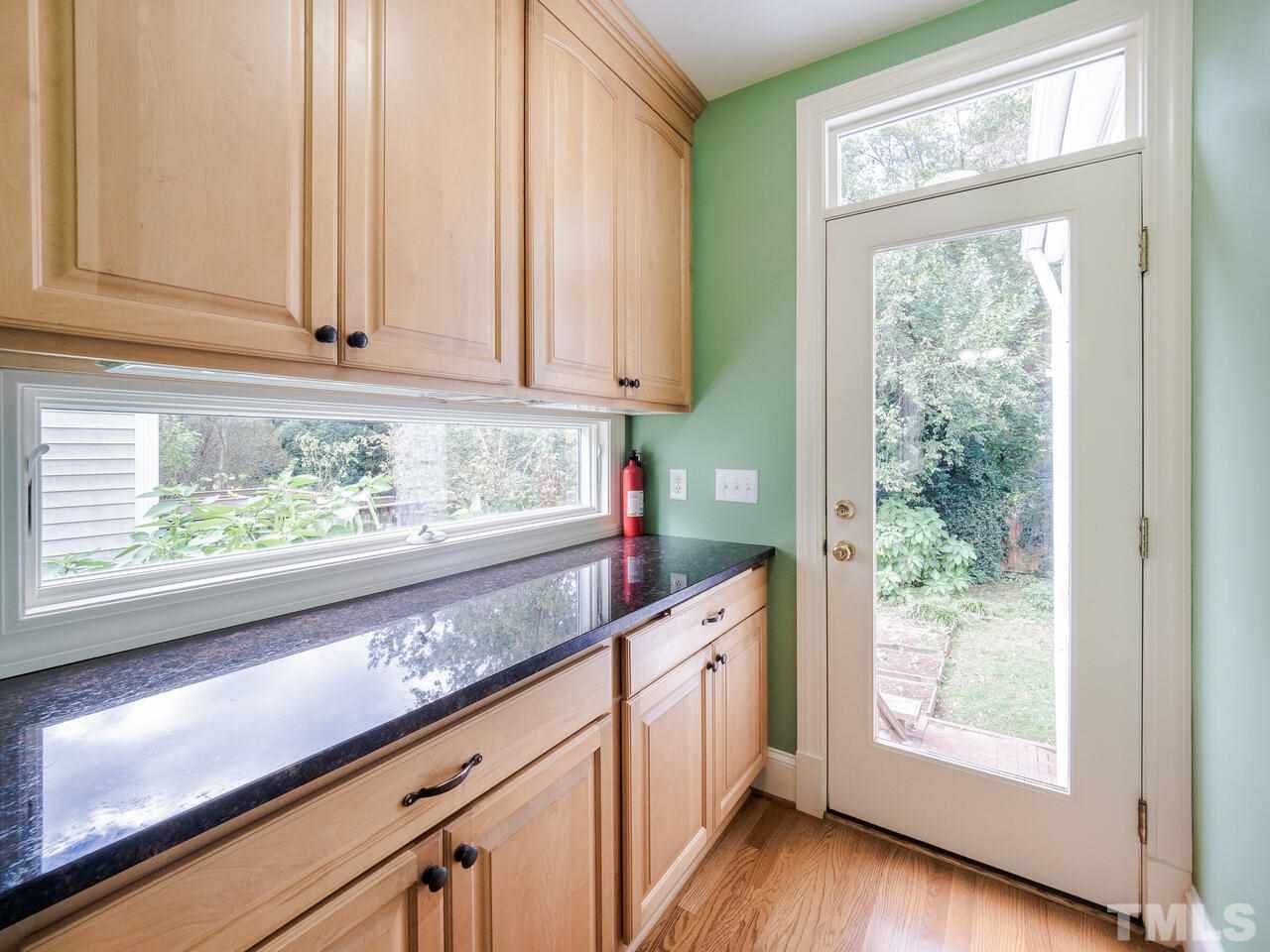 408 Morrison Avenue Raleigh, NC 27608 - Photo 10 of 29 No excuses for not enough kitchen storage options with this spacious pantry.