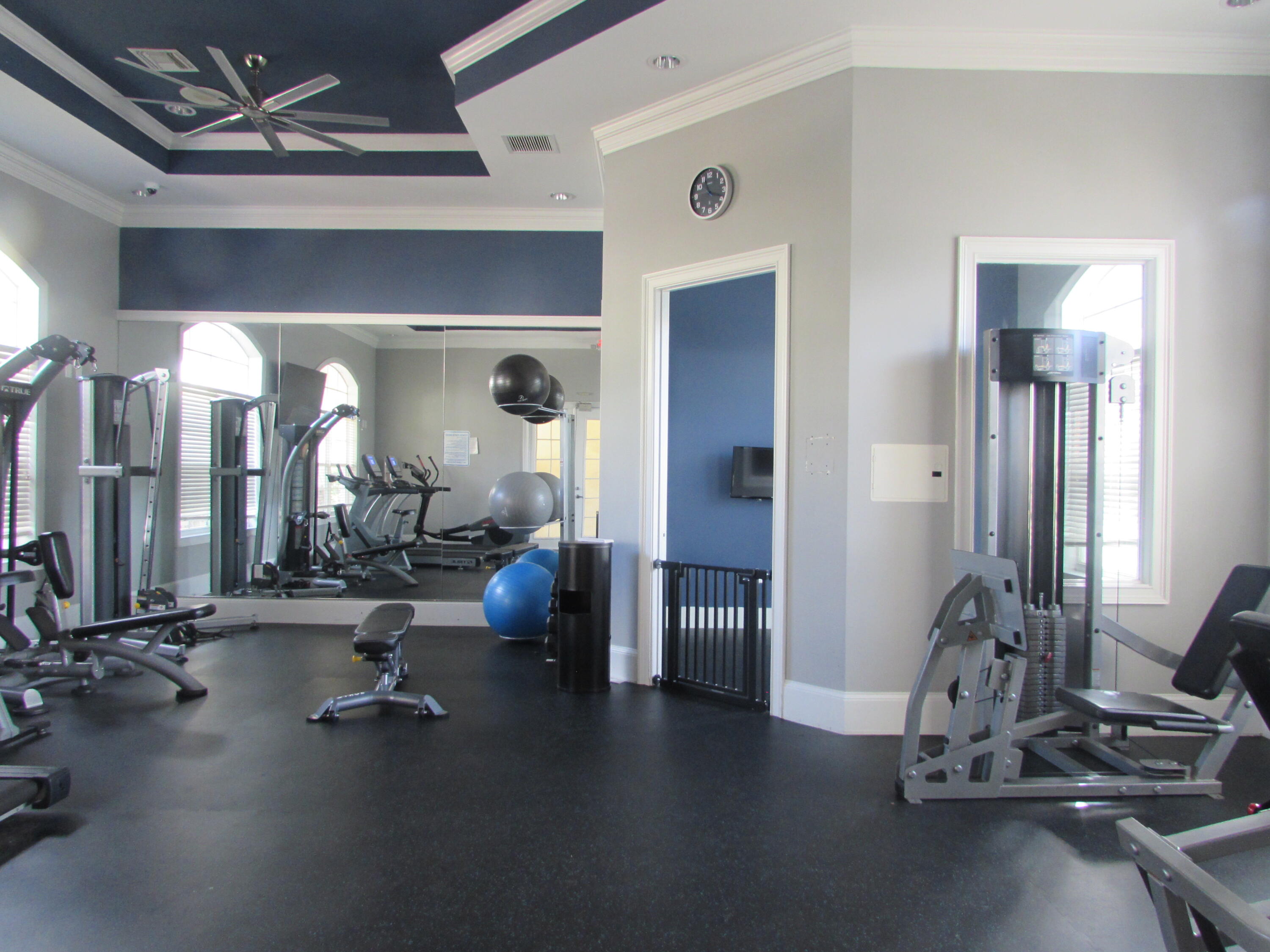 9873 Baywinds Boulevard, Unit 5107 West Palm Beach, FL 33411 - Photo 21 of 22 a view of a room with gym equipment