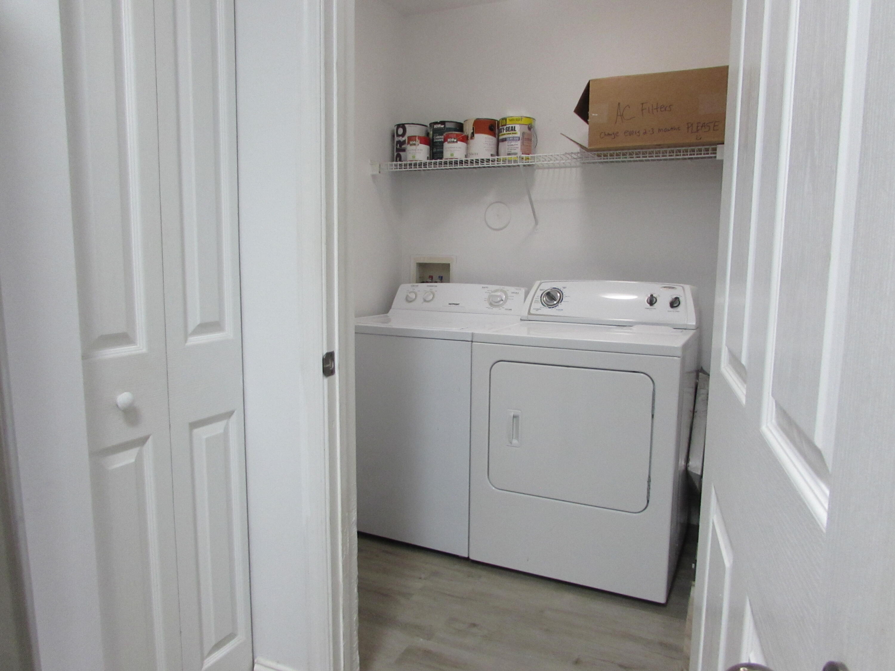 9873 Baywinds Boulevard, Unit 5107 West Palm Beach, FL 33411 - Photo 5 of 22 a utility room with dryer and washer