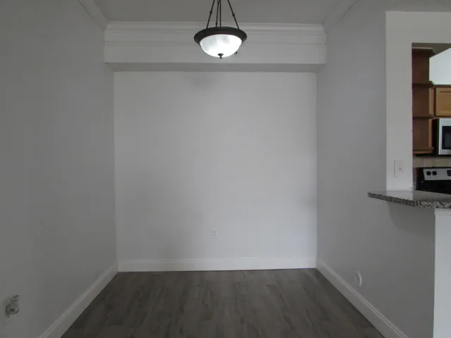a view of a room with rack and wooden floor