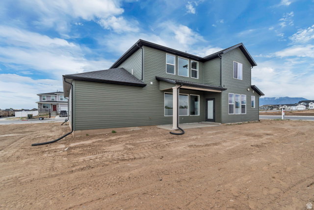 3317 South 1000 West, Unit 6010 Logan, UT 84321 - Photo 4 of 34 Rear view of property with a mountain view and a patio