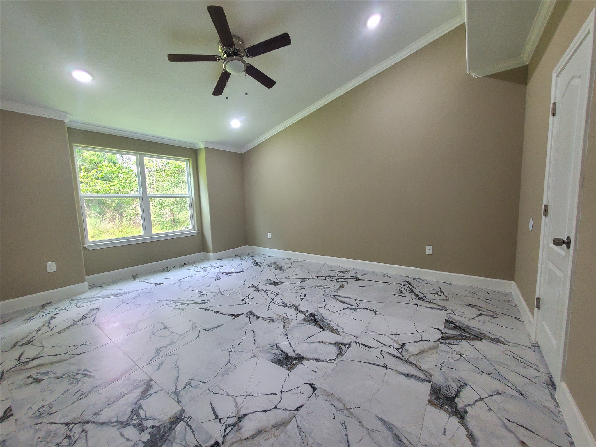 1306 North 9th Street Conroe, TX 77301 - Photo 31 of 47 a bedroom with a bed and a window