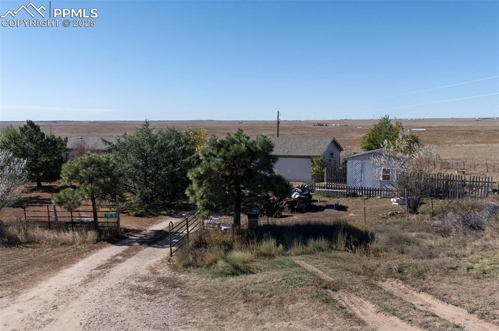 35355 Funk Road Calhan, CO 80808 - Photo 5 of 31 a view of swimming pool with seating area and trees around