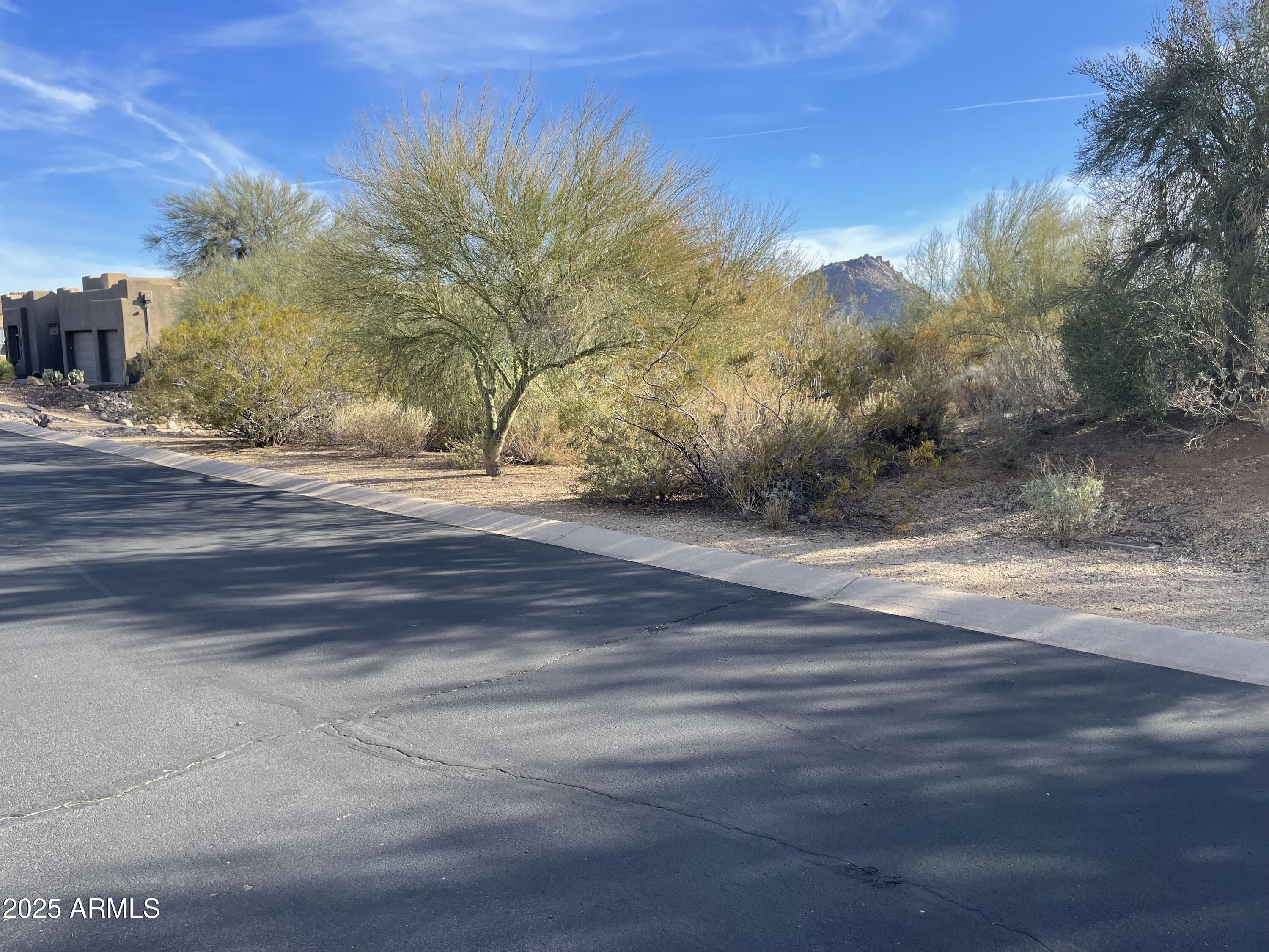 10935 East Mark Lane, Unit 75 Scottsdale, AZ 85262 - Photo 3 of 8 a view of a yard with a house