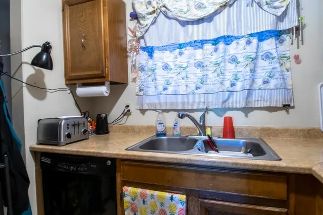 a kitchen with a sink and cabinets
