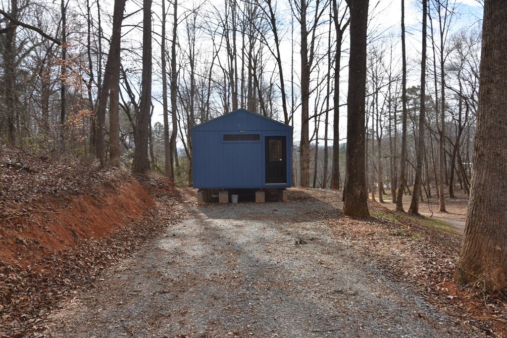 167 Swaims Road Hayesville, NC 28904 - Photo 12 of 69 a view of a backyard with large trees and wooden fence