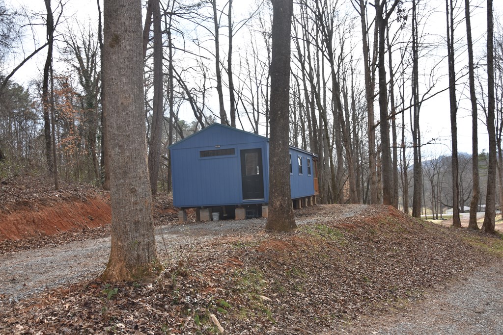 167 Swaims Road Hayesville, NC 28904 - Photo 19 of 69 a backyard of a house with lots of green space