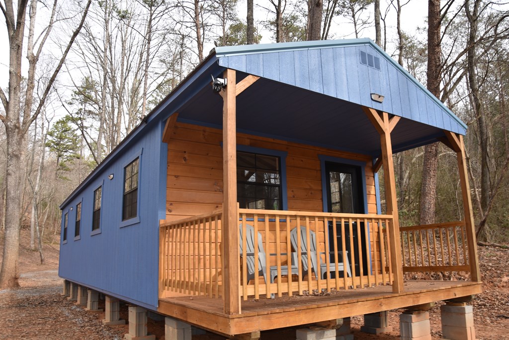 167 Swaims Road Hayesville, NC 28904 - Photo 10 of 69 a view of a house with a deck and furniture