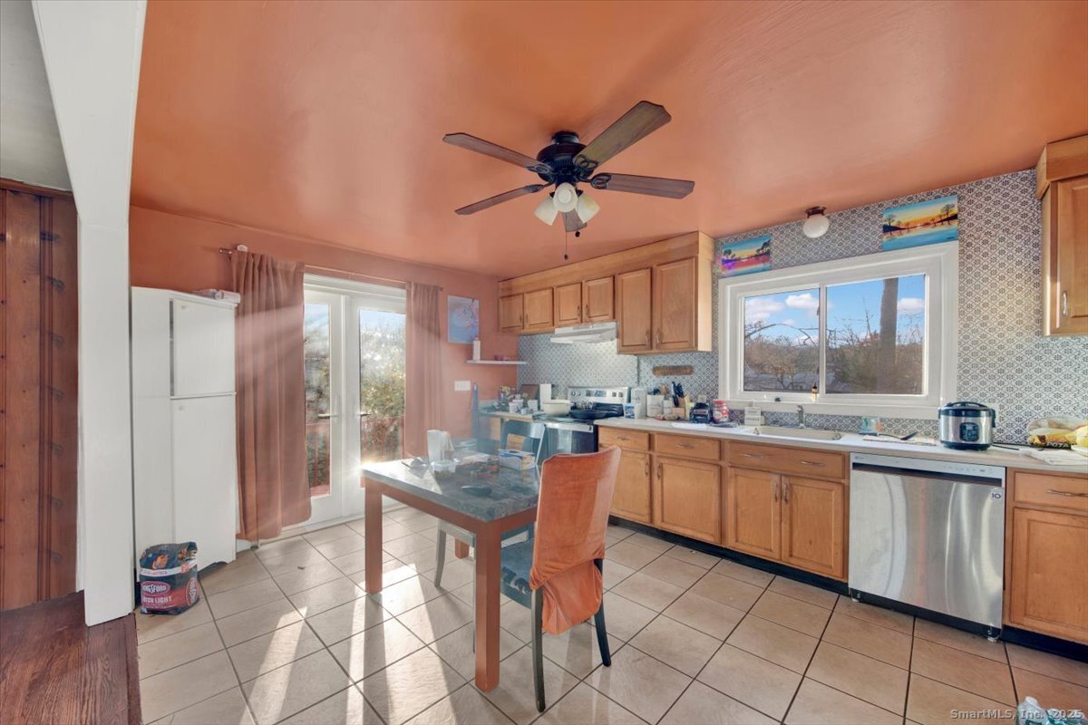 375 Silver Street Bridgeport, CT 06610 - Photo 12 of 21 a kitchen with a sink and cabinets