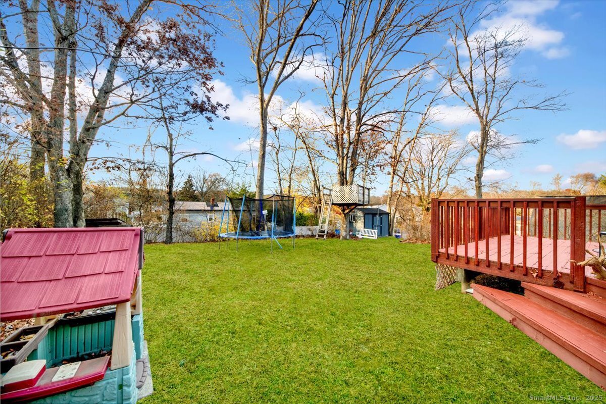 375 Silver Street Bridgeport, CT 06610 - Photo 6 of 21 a view of a backyard with wooden fence