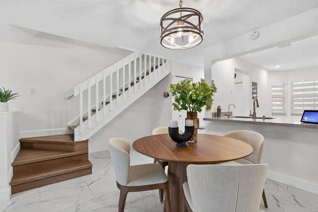 a view of hall way with furniture