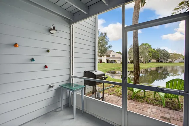 a view of a balcony with chairs