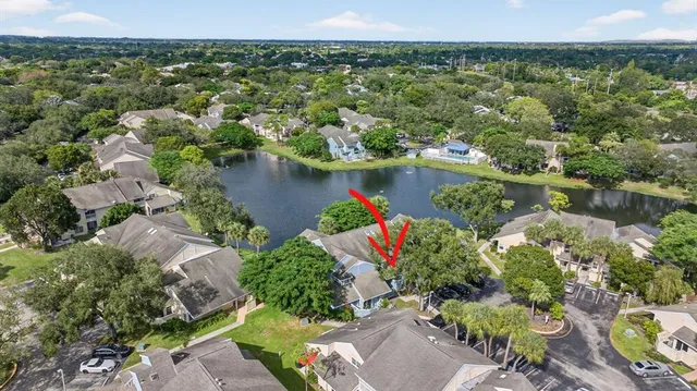 an aerial view of a house with a lake view