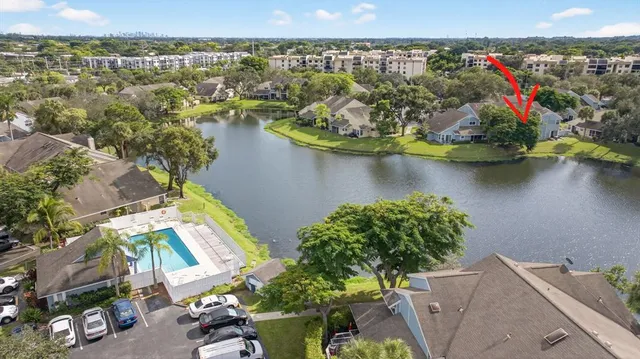 an aerial view of a house with a lake view