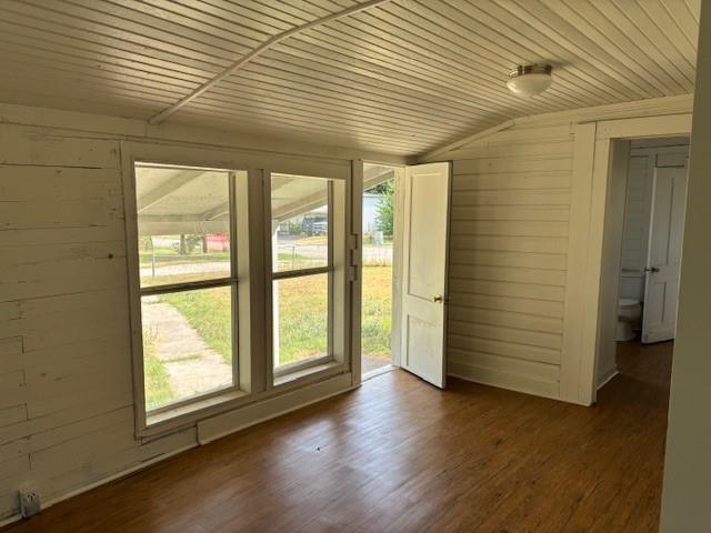 811 West 8th Street Cisco, TX 76437 - Photo 14 of 22 an empty room with wooden floor and windows