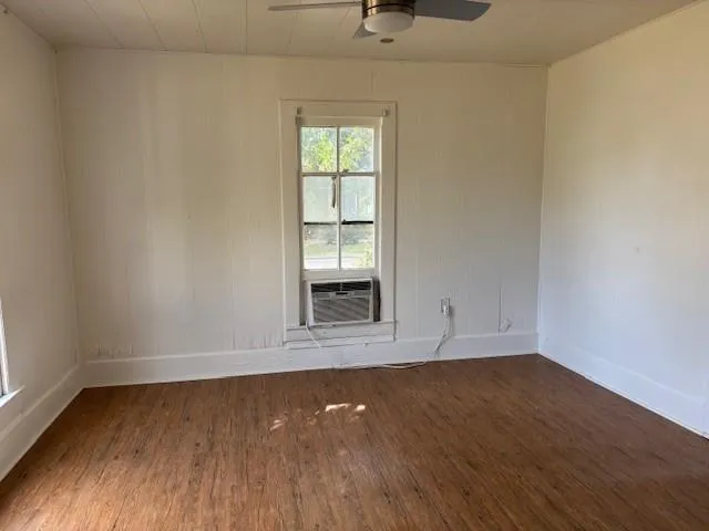 wooden floor and window in an empty room