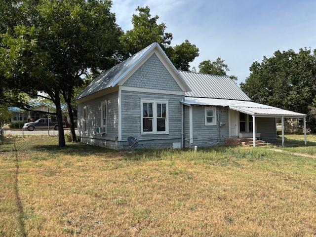 811 West 8th Street Cisco, TX 76437 - Photo 4 of 22 a view of a house with a yard