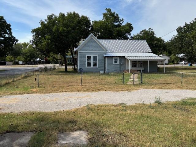 811 West 8th Street Cisco, TX 76437 - Photo 5 of 22 a front view of a house with a yard